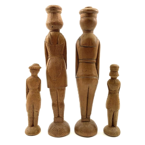 48 - A pair of pitch pine folk art peg figures of a French sailor and a lady. Late 19th century, the cap ... 