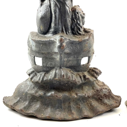 49 - A Victorian cast iron doorstop. Cast as Britannia on the bow of a ship, height 41cm, together with a... 