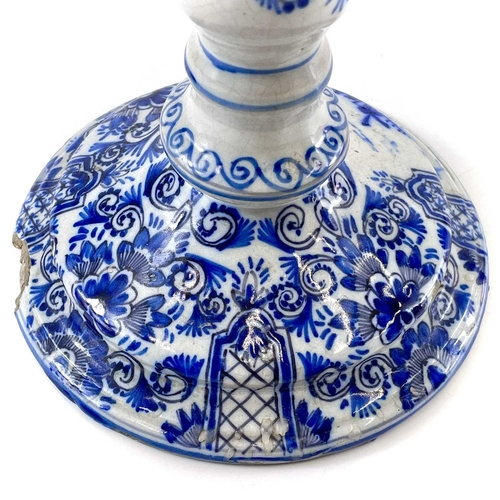 256 - A late eighteenth century delft candle holder. Height 22cm.