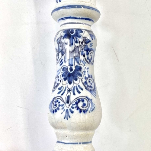 256 - A late eighteenth century delft candle holder. Height 22cm.