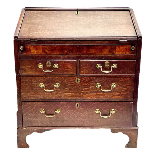 260 - A George II oak bureau, the fall front opening to reveal a fitted interior. Above two short and two ... 