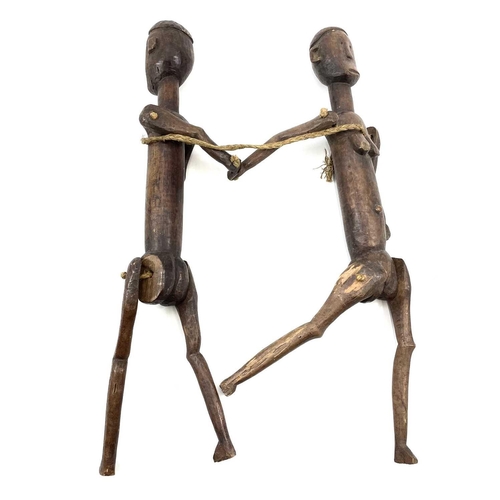 428 - 20th Century East African Nyamweze marionette twins from the studio of John Miller. 57cm in height. ... 