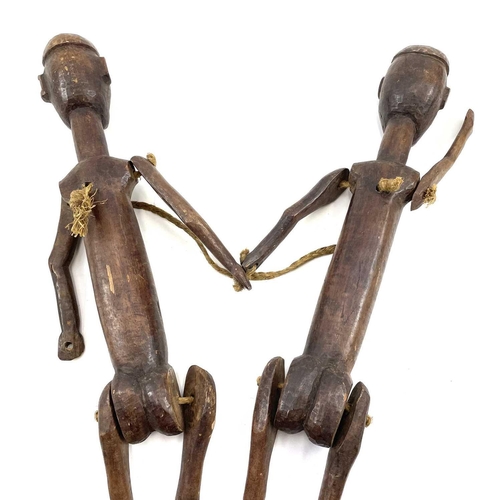 428 - 20th Century East African Nyamweze marionette twins from the studio of John Miller. 57cm in height. ... 