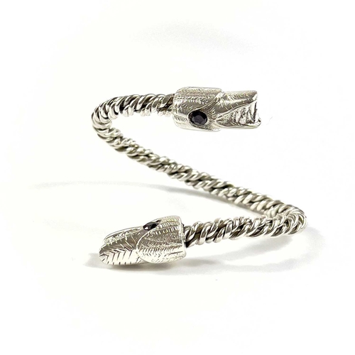 680 - James SUDDABY A contemporary .999 fine silver dragon bangle With garnet set eyes, Birmingham hallmar... 