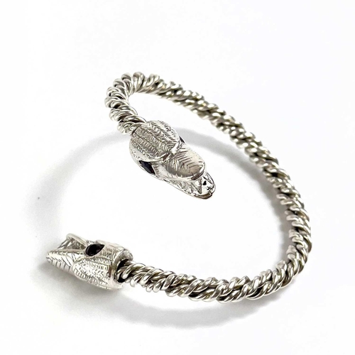 680 - James SUDDABY A contemporary .999 fine silver dragon bangle With garnet set eyes, Birmingham hallmar... 