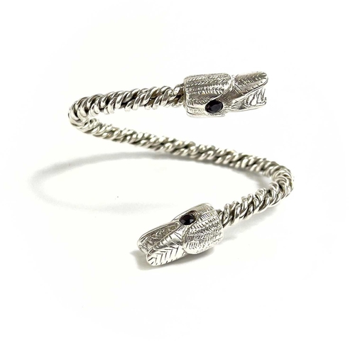 680 - James SUDDABY A contemporary .999 fine silver dragon bangle With garnet set eyes, Birmingham hallmar... 