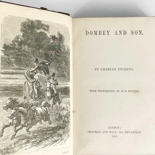 24 - Bindings. A handsome set of nine works by Charles Dickens, half black calf with marbled boards and c... 