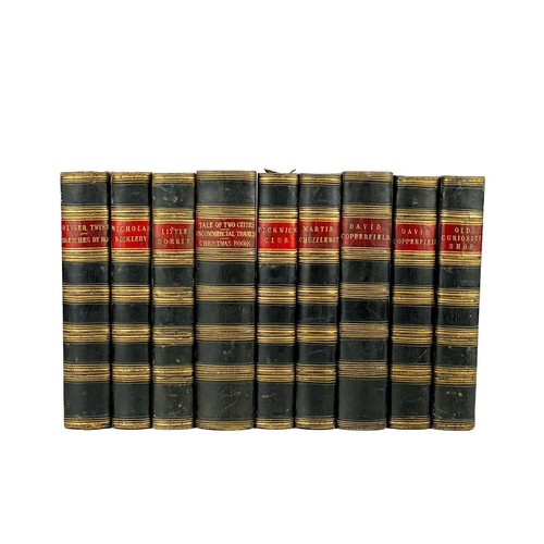 24 - Bindings. A handsome set of nine works by Charles Dickens, half black calf with marbled boards and c... 