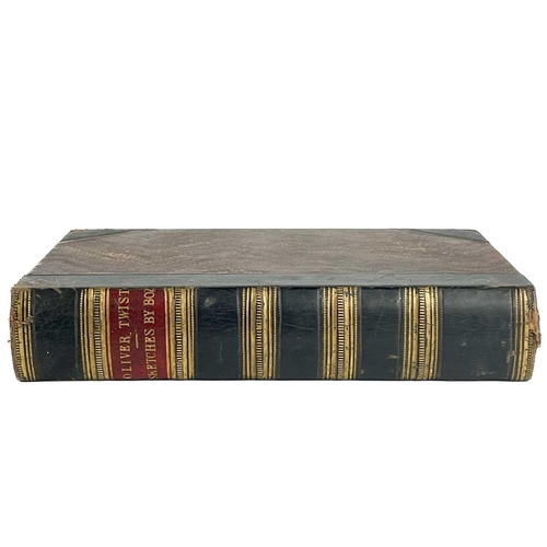 24 - Bindings. A handsome set of nine works by Charles Dickens, half black calf with marbled boards and c... 