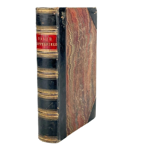 24 - Bindings. A handsome set of nine works by Charles Dickens, half black calf with marbled boards and c... 