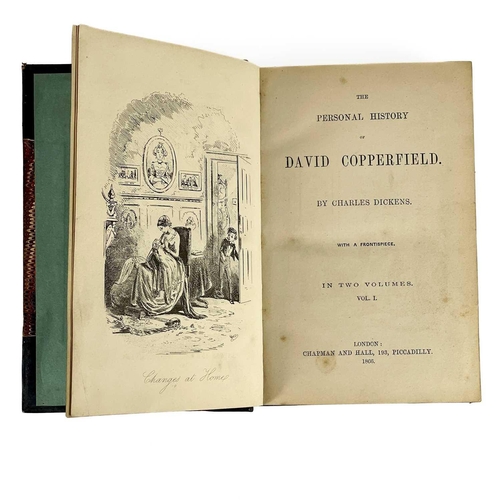 24 - Bindings. A handsome set of nine works by Charles Dickens, half black calf with marbled boards and c... 