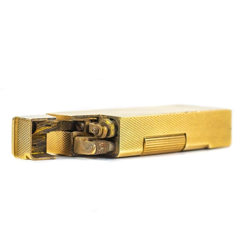 A rare 9ct gold Rollboy lighter by Bach Cooper for Alfred
