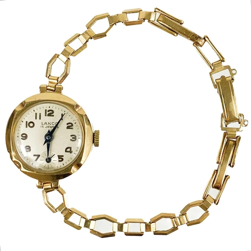 92 - A 9ct gold lady's manual wind bracelet wristwatch. The 18mm silvered dial signed Lanco, 15 jewel mov... 