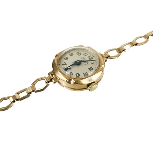 92 - A 9ct gold lady's manual wind bracelet wristwatch. The 18mm silvered dial signed Lanco, 15 jewel mov... 