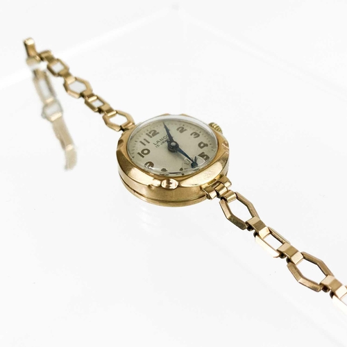 92 - A 9ct gold lady's manual wind bracelet wristwatch. The 18mm silvered dial signed Lanco, 15 jewel mov... 