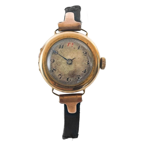 93 - An early 20th century 9ct rose gold lady's manual wind wrist watch. The 18mm silvered dial with Arab... 