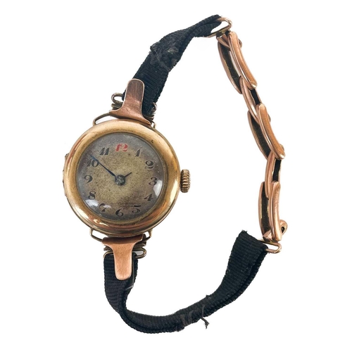 93 - An early 20th century 9ct rose gold lady's manual wind wrist watch. The 18mm silvered dial with Arab... 