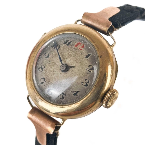 93 - An early 20th century 9ct rose gold lady's manual wind wrist watch. The 18mm silvered dial with Arab... 