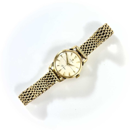 100 - A 1950's 9ct Omega lady's manual wind bracelet wristwatch. Cal. 244, the signed silver 18mm dial wit... 