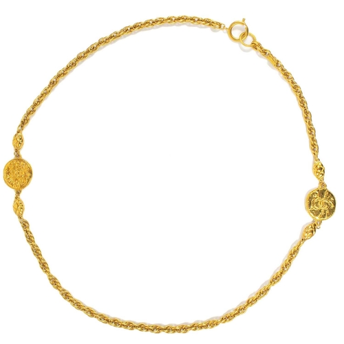 122 - A Chanel 1970's gold-tone medallion necklace. The two medallions with cast inscription CHANEL FRANCE... 