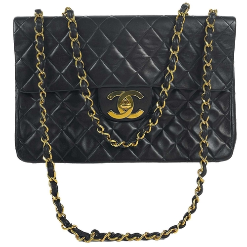 125A - A Chanel black lambskin jumbo maxi single flap bag. Circa 1994-1996, with gold-tone hardware, burgun... 