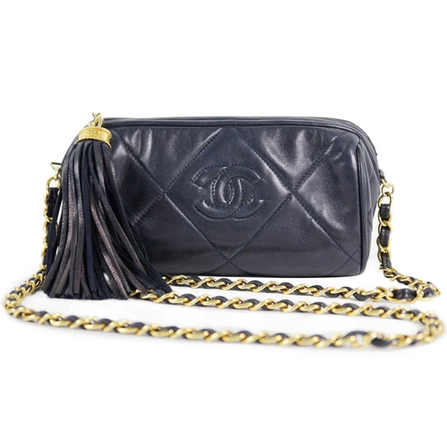 130A - A Chanel blue lambskin quilted navy blue leather barrel camera bag. Circa 1986-1988, gold-tone hardw... 