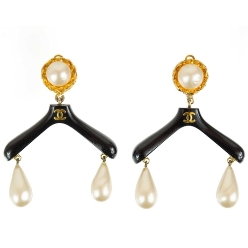 135 - A Chanel rare pair of 1980's 'coat hanger' gold-tone clip earrings. With applied faux pearl applied ... 