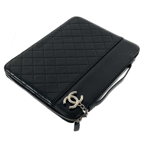 135A - A Chanel black lambskin quilted leather mini ipad case. Circa 2010-2011, silver hardware, serial sti... 