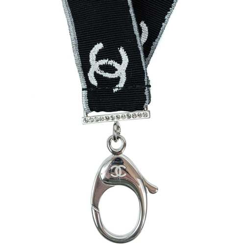 136 - A Chanel white tone metal and crystal set CC lanyard. Etched mark B17 S, length 44cm.