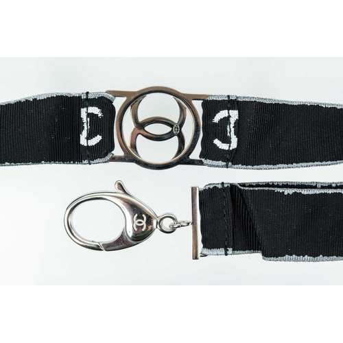 136 - A Chanel white tone metal and crystal set CC lanyard. Etched mark B17 S, length 44cm.