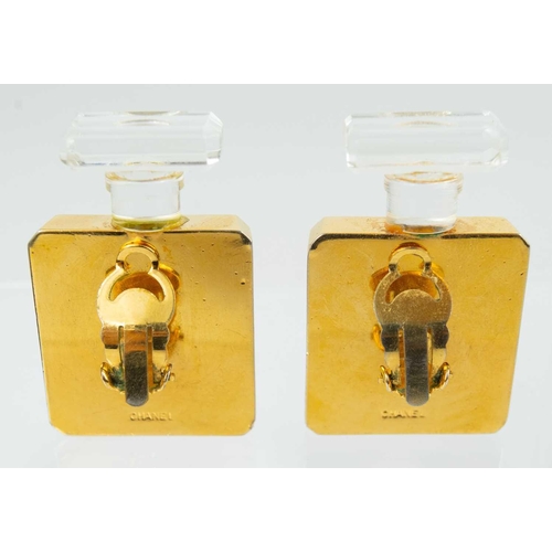 141 - A rare pair of Chanel 1980's Coco Chanel perfume bottle earrings. In gold tone, both stamped CHANEL,... 