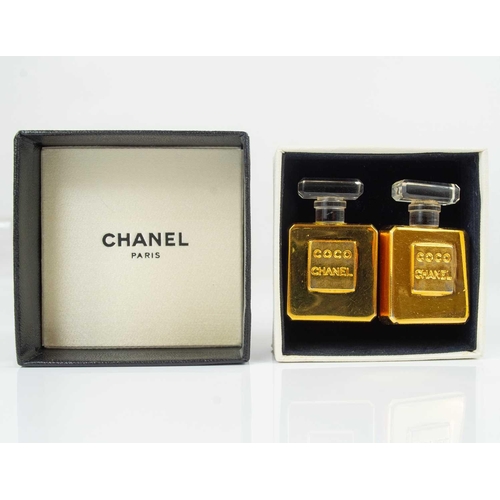 141 - A rare pair of Chanel 1980's Coco Chanel perfume bottle earrings. In gold tone, both stamped CHANEL,... 