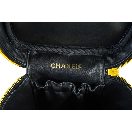 143 - A Chanel black cavier leather vanity case. Circa 1996-97, serial no. 420xxxx, autenticity card and d... 