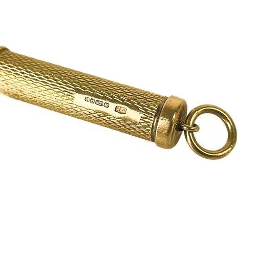 47 - A George V 9ct gold propelling tooth pick fob. With engine turned decoration, Sheffield 1923, 6.39g.