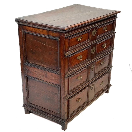 109 - An 18th century oak chest of drawers. With four long drawers raised on block feet, height 99cm width... 