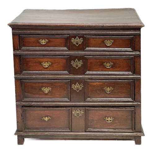 109 - An 18th century oak chest of drawers. With four long drawers raised on block feet, height 99cm width... 