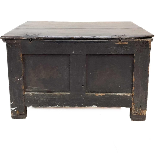 116 - An 18th century small oak coffer. Fitted a candle box, with a stop fluted frieze and two panel front... 