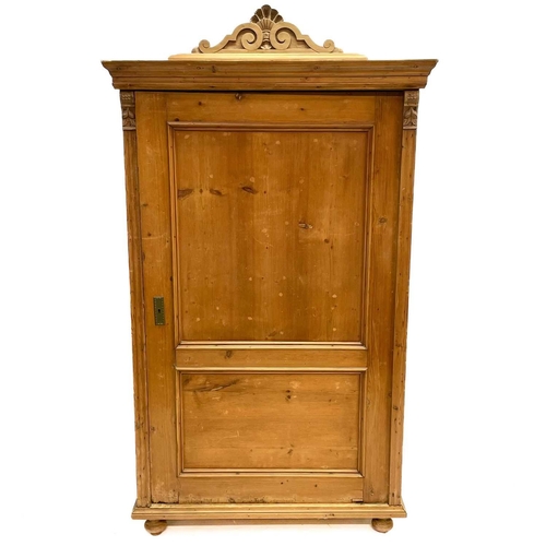 117 - A 19th century Cornish pine standing corner cupboard. With an astragal glazed door above two short d... 