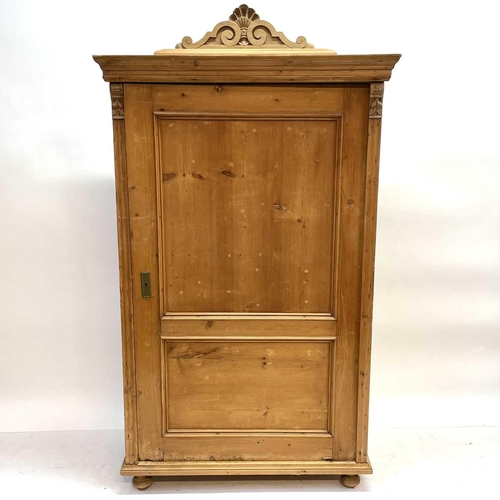 117 - A 19th century Cornish pine standing corner cupboard. With an astragal glazed door above two short d... 