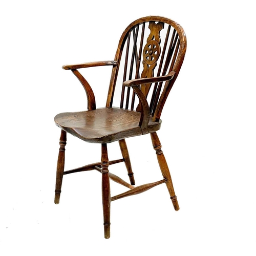 126 - A 19th century ash, elm and Fruitwood Windsor armchair. Carved S I? to the rear of the seat, height ... 