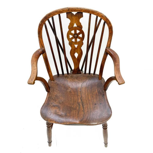 126 - A 19th century ash, elm and Fruitwood Windsor armchair. Carved S I? to the rear of the seat, height ... 