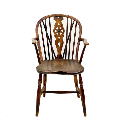 126 - A 19th century ash, elm and Fruitwood Windsor armchair. Carved S I? to the rear of the seat, height ... 