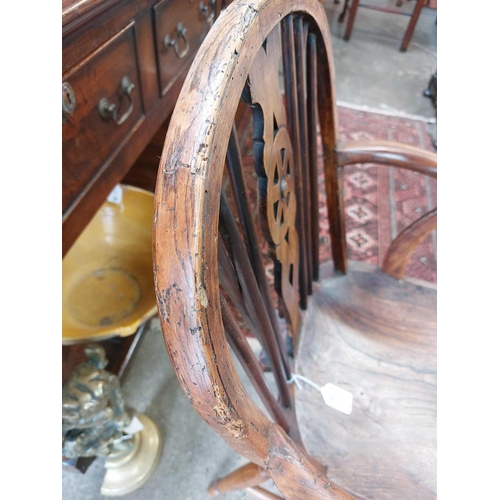 126 - A 19th century ash, elm and Fruitwood Windsor armchair. Carved S I? to the rear of the seat, height ... 