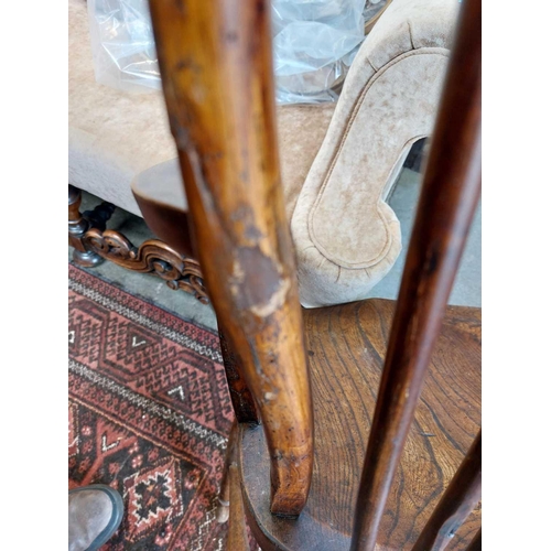 126 - A 19th century ash, elm and Fruitwood Windsor armchair. Carved S I? to the rear of the seat, height ... 