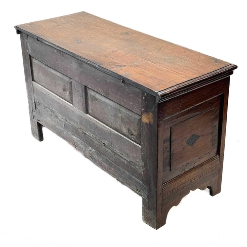 130 - An oak joined small mule chest. Early 18th century, the interior fitted a candle box, the three pane... 