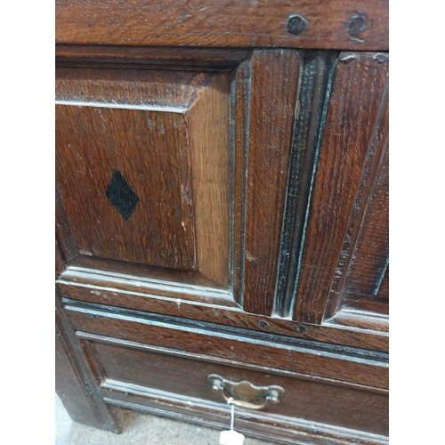 130 - An oak joined small mule chest. Early 18th century, the interior fitted a candle box, the three pane... 