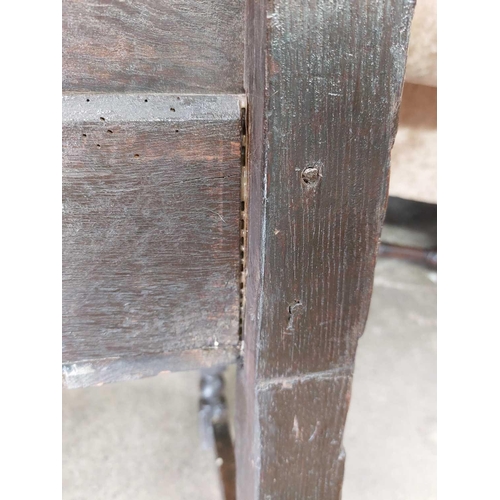 132 - A 17th century North Country bobbin Wainscot chair. With a shaped top rail, central carved lozenge a... 