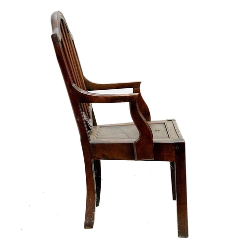 134 - A late George III country made elm commode chair. With slat back, lift up seat and square legs.