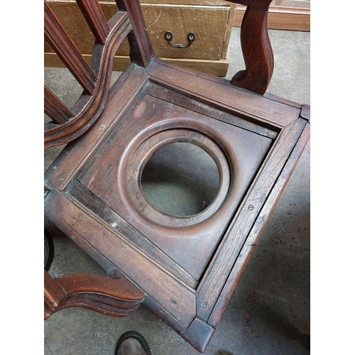 134 - A late George III country made elm commode chair. With slat back, lift up seat and square legs.