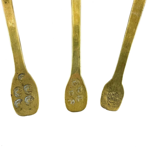 136 - A group of eight French brass spoons. 19th century, the finials variously punch struck with acorns, ... 